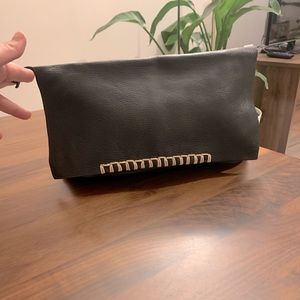 Black leather clutch with white stitching